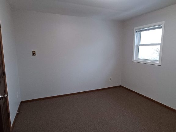 Bedroom 1. Adjacent to the bathroom.