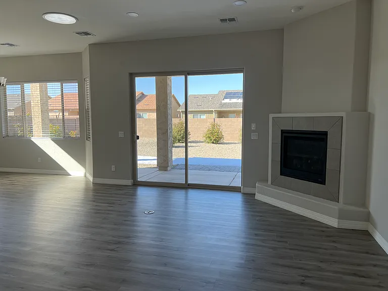 Living Room with Gas Fireplace and Slider to Back Yard & Patio