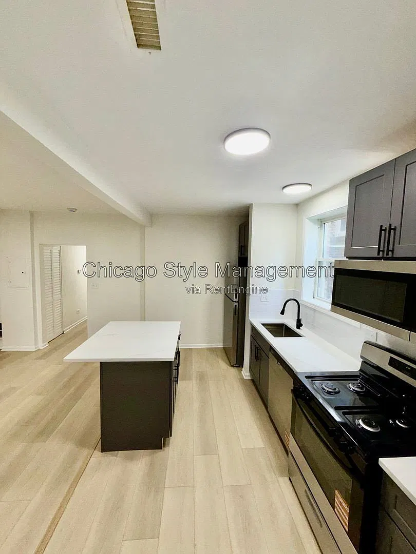 7833 S Colfax Ave — Photo 3