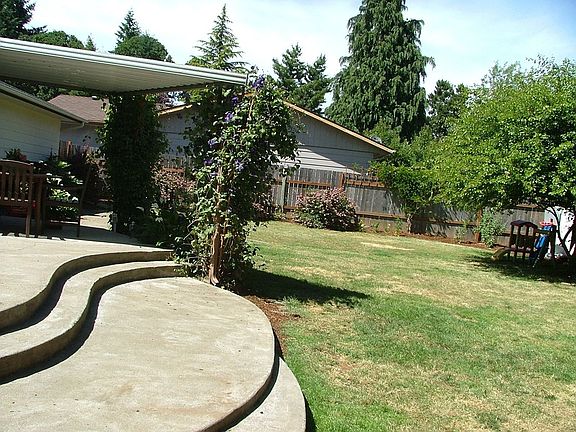 Backyard with partially-covered patio