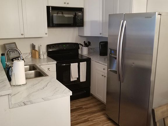 Absolutely gorgeous new kitchen, white Calcutta countertops, samsung ss fridge