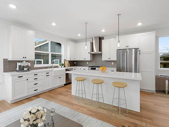 Spacious kitchen and open living space - view 2