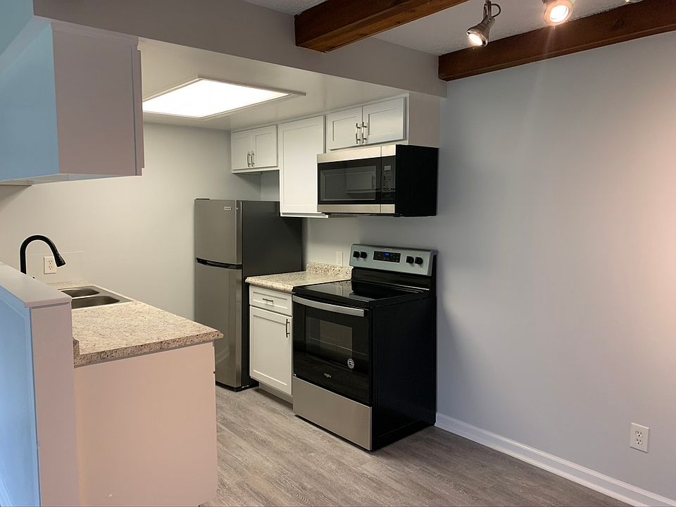 Kitchen with Electric Stove, Microwave, Refrigerator, and Dishwasher