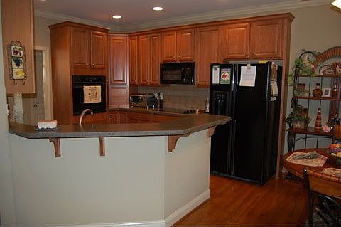 Kitchen features breakfast bar.