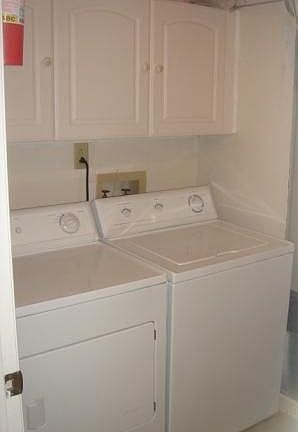 Laundry room with ceramic tile flooring
