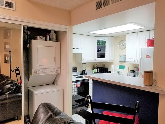 Kitchen View with Stacked Laundry