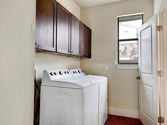 Laundry with lots of storage (washer/dryer included!)