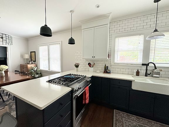 fully appointed kitchen with gas range and downdraft vent