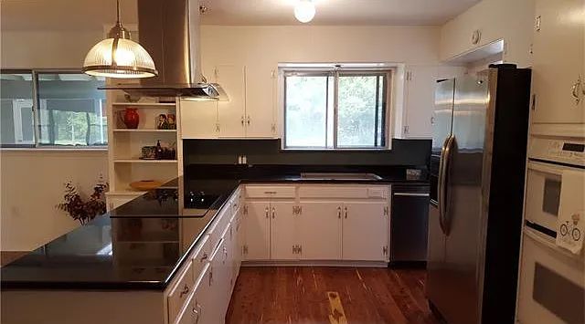 New granite countertops, new disposal, new cooktop, new sink and faucets