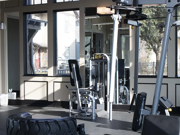Experience your daily workout in this vibrant, naturally lit fitness center.