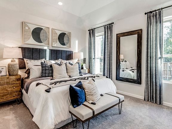 The owner s suite is tucked into the back of the home for maximum privacy and includes a full bathro