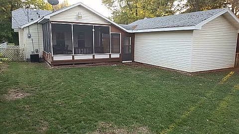 Deck, yard, and garage.