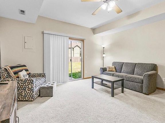 Spacious living room that has a slider to the back patio. Lots of natural light.