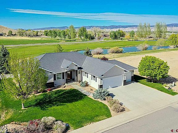 Ariel view of home located in Cobble Creek on 9th hole with Fenced in backyard.
