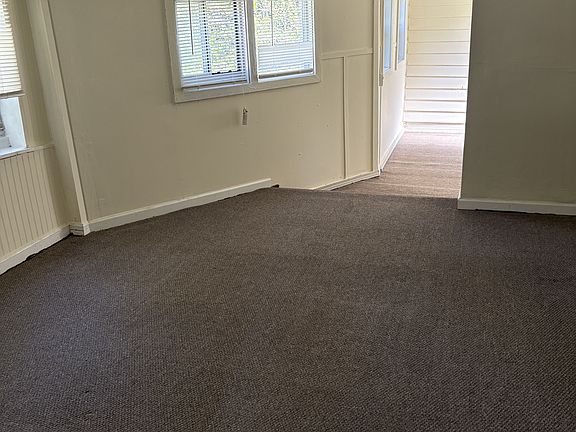 Main bedroom with adjacent room at the back for fitness equipment or bike storage or study or hobby or crafts or additional storage and closet space