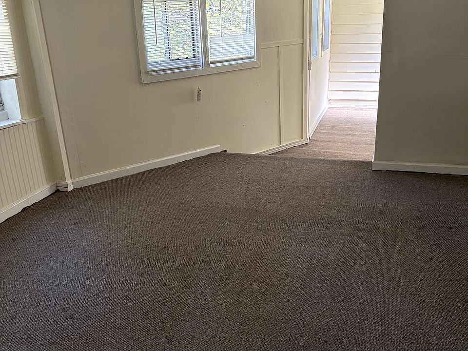 Main bedroom with adjacent room at the back for fitness equipment or bike storage or study or hobby or crafts or additional storage and closet space