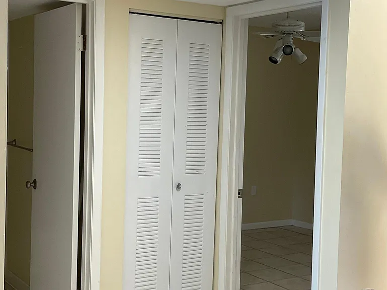 Second bathroom and bedroom entrance from kitchen.