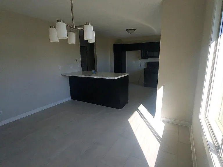 Dining room looking into kitchen.