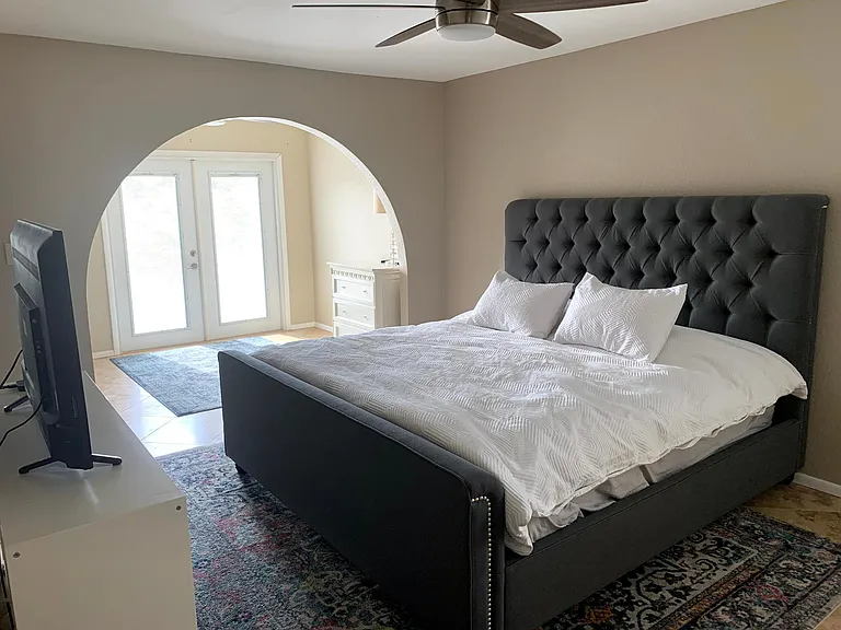 Master bedroom with bonus space. King sized bed pictured.