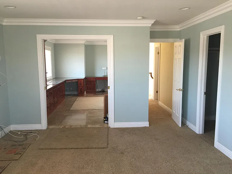 Master bedroom look towards the office and hallway. Also has a walk-in closet.