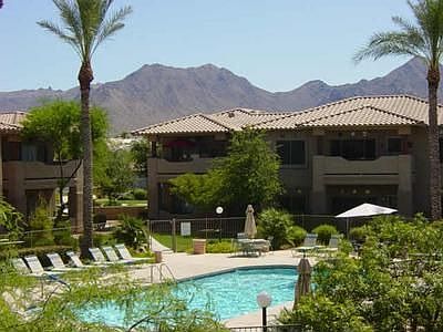 Large Window and Patio with Pool and Mountain Views