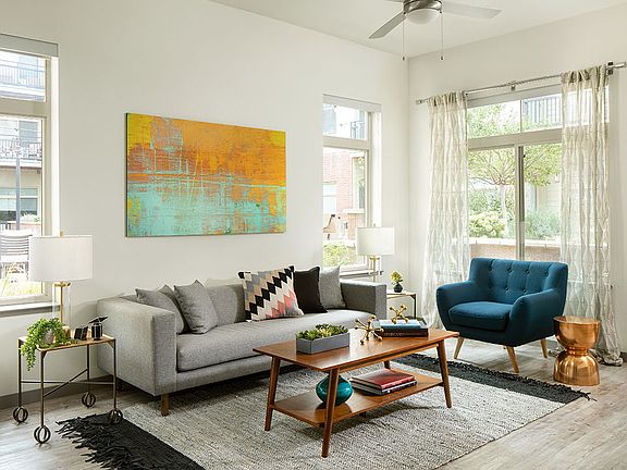 Apartment Living Room with Hardwood Flooring and Balcony.