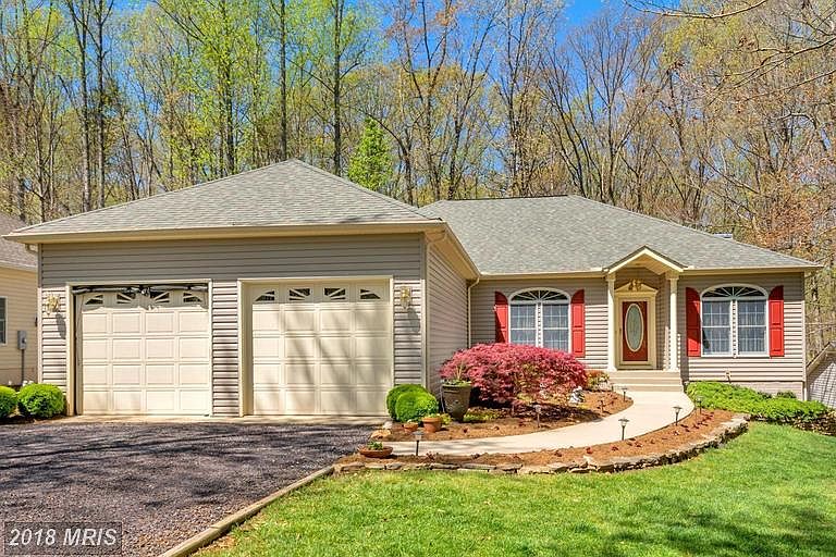 Front of home, beautifully landscaped
