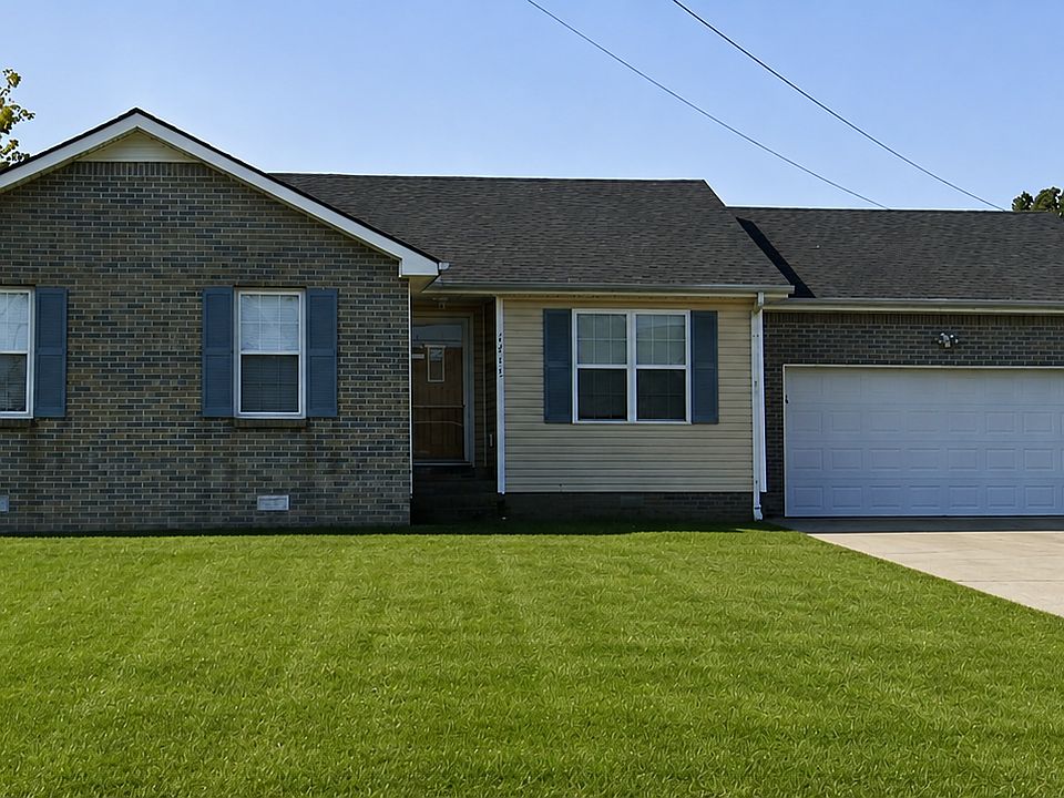 Beautiful corenr lot with attached garage and long driveway with enough parking for multiple vehicles.