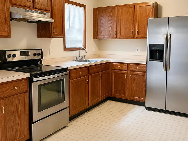 Spacious eat-in kitchen featuring stainless steel appliances