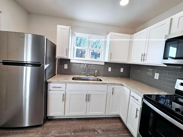 Full size refrigerator with ice maker.