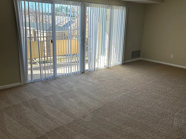 Living Room / Dining look out to balcony overlooking Park Heights Avenue