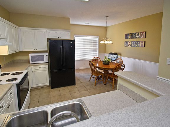 Sunny Eat-In Kitchen with French Door to Backyard & Patio