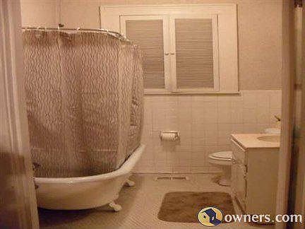 clawfoot tub and original tile