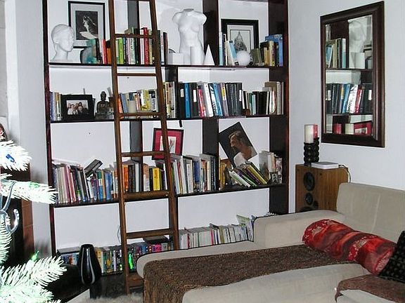built-in bookshelves w/ rolling library ladder from victorian Golen Hill mansi
