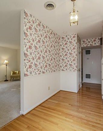 FOYER WITH GLEEMING HARDWOOD