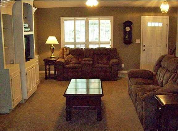 Open floor plan with kitchen opening into dining area and great room