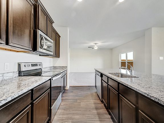 The spacious kitchen is perfect for preparing your family s favorite meals and treats.