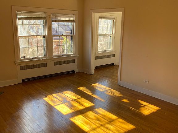 Living room from near front entry and adjoining dining room. South exposure