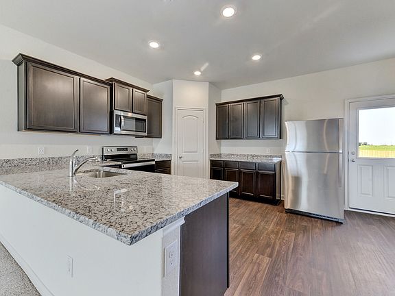 The kitchen comes with a full suite of energy-efficient appliances
