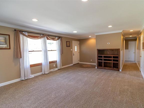 Spacious living room with newer carpet