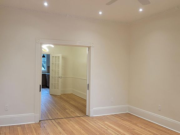 Living room view to kitchen via dining