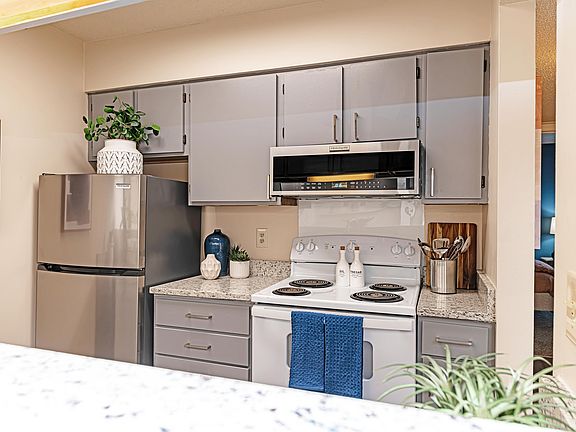 Kitchen with granite counters and modern cabinetry