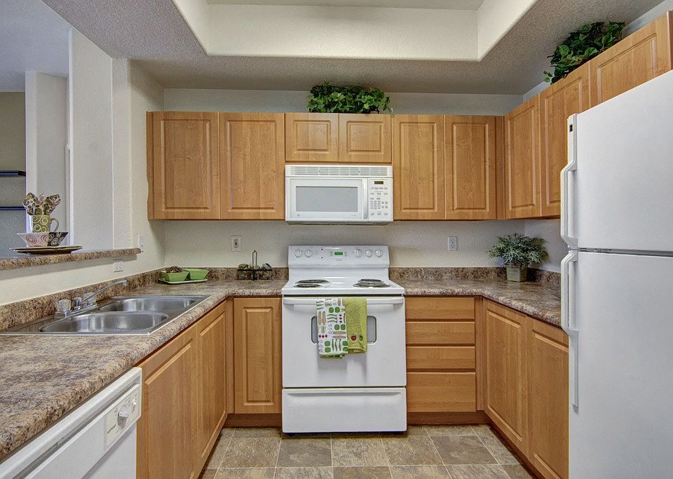 Arezzo Apartments- spacious kitchen with wooden cabinets