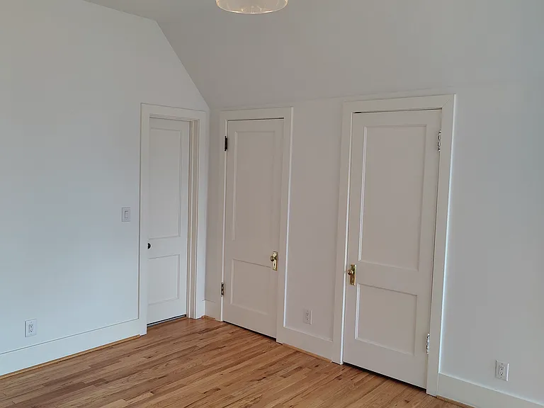 Closets and bathroom door of the NE bedroom