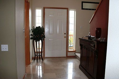 Marble entry with high ceilings
