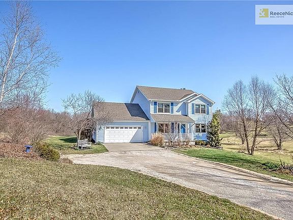 LONG DRIVEWAY TO THIS 2 STORY ON BEAUTIFUL 3 ACRE LOT