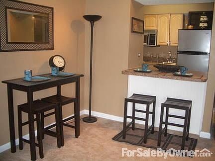 Another view from family room
						:
						This is a view from the couch. Windows across the entire unit.