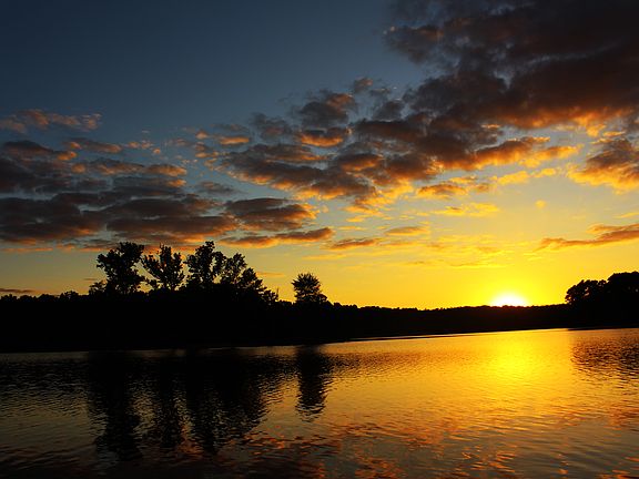 Amazing sunsets from the house. This photo shows a Lake Wylie beach off the Carolina Thread Trail about a 10 minute walk / 5 minute bike ride from the home / you can also drive to the end of Mayapple as there is community parking (2 minute drive).
