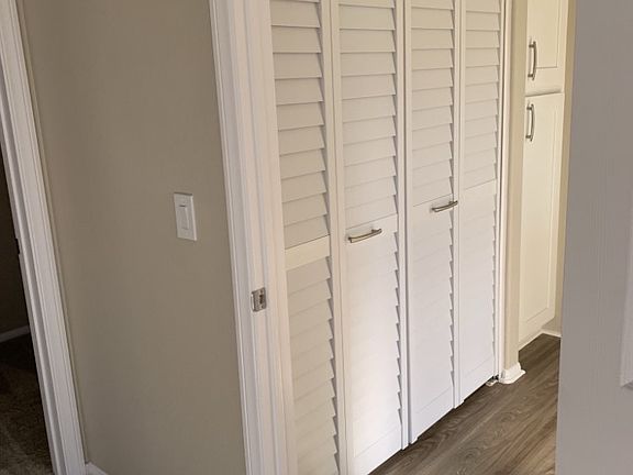 Upstairs hallway with laundry.