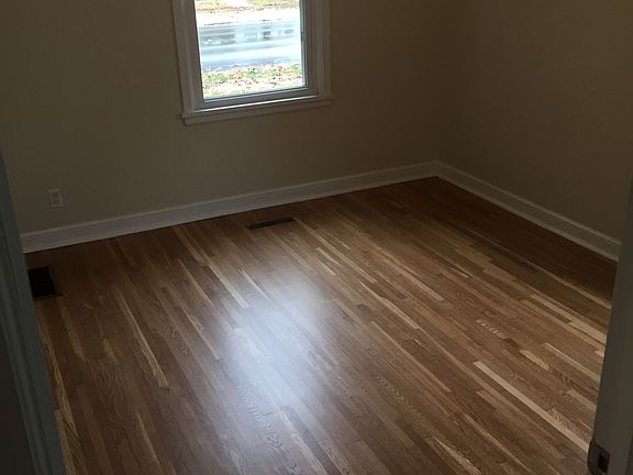 Newly refinished wood floors.